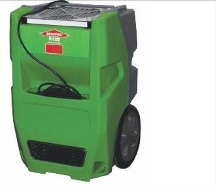 green dehumidifier with cord wrapped in front