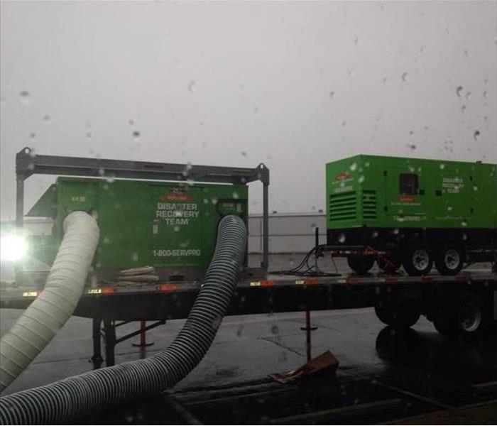 two large desiccant dehumidifiers outside 
